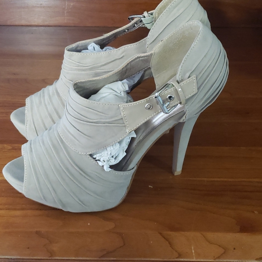 Lightl used heels made by Charlotte Russe. Size 9.